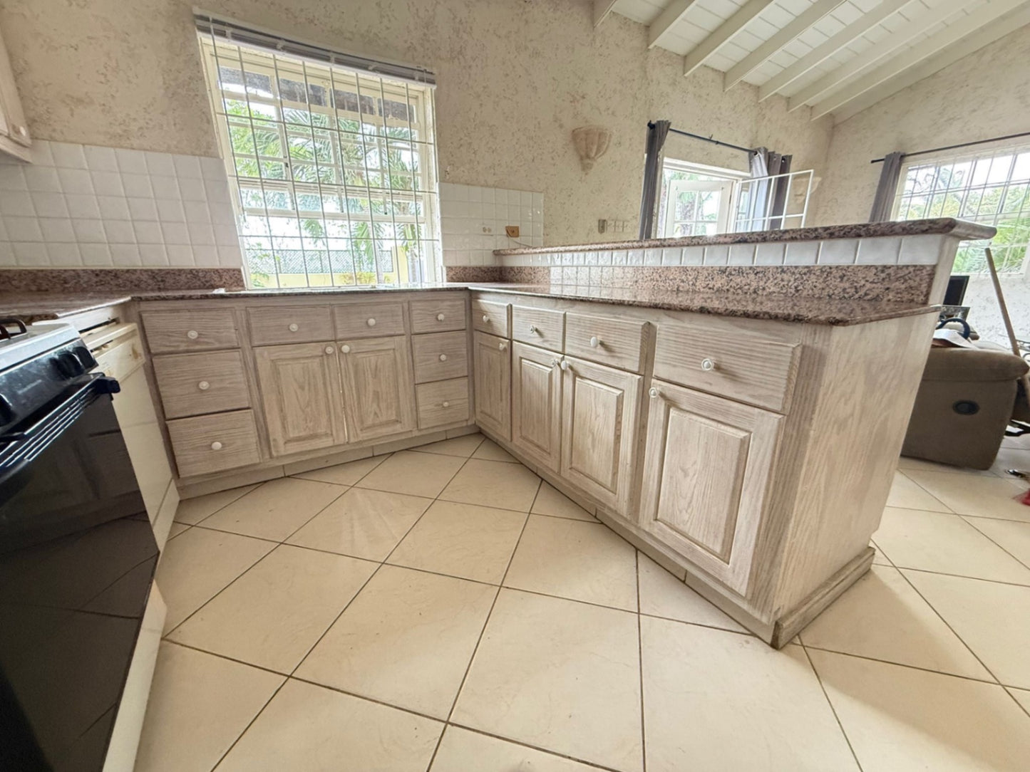 COMPLETE SOLID WOODEN U SHAPE KITCHEN CABINETRY W/ GRANITE COUNTERTOP + BAR (OVERALL MEASUREMENTS: 105” x 120” x 95”) - BUYER TO REMOVE
